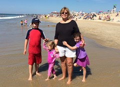 Carole Grills enjoying the beach with her grandchildren.